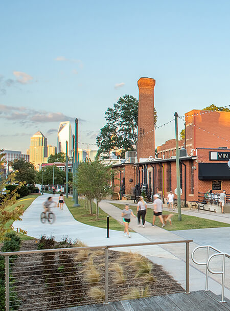 People enjoy a walk/bike trail and shopping area